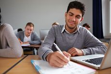 student taking test in class