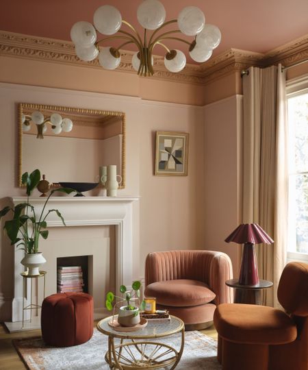 Living room in Queen Anne Pink by Benjamin Moore, layered with rich earthy tones