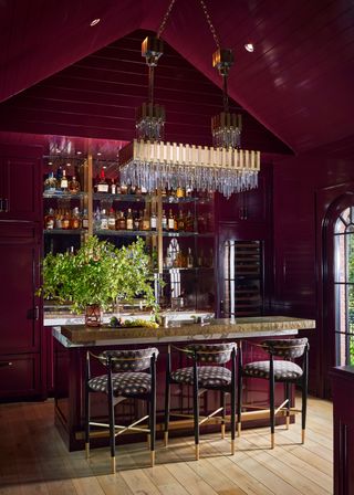 A bar space with red toned walls