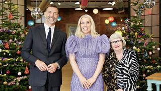 Patrick Grant, Sarah Pascoe and Esme Young flanked by Christmas trees in Great British Sewing Bee Christmas Special 2024