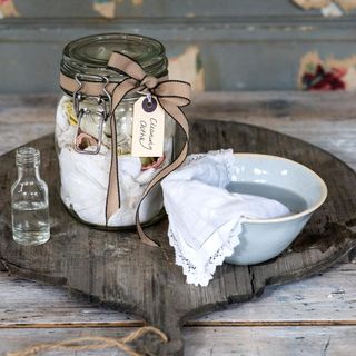 glass jar with white bowl and white cloths