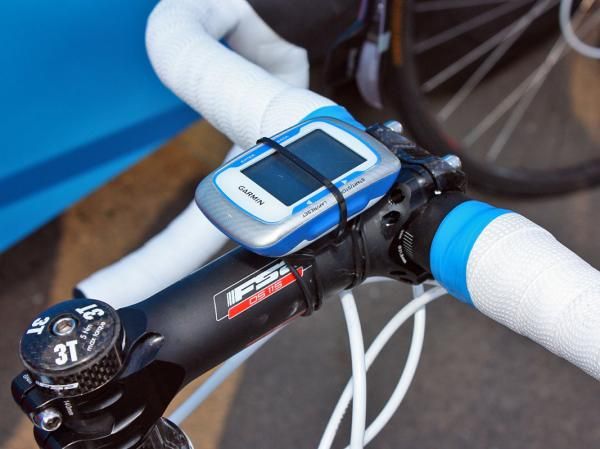 Milram team mechanics add a zip-tie to ensure the Garmin Edge 500 computers don't rattle out of their mounts.