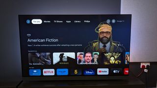 Philips OLED908 with Google TV home menu on screen