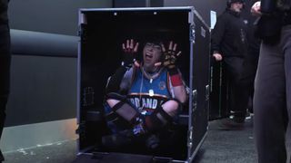 Still of Billie Elish inside a packing case