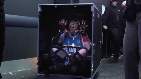 Still of Billie Elish inside a packing case