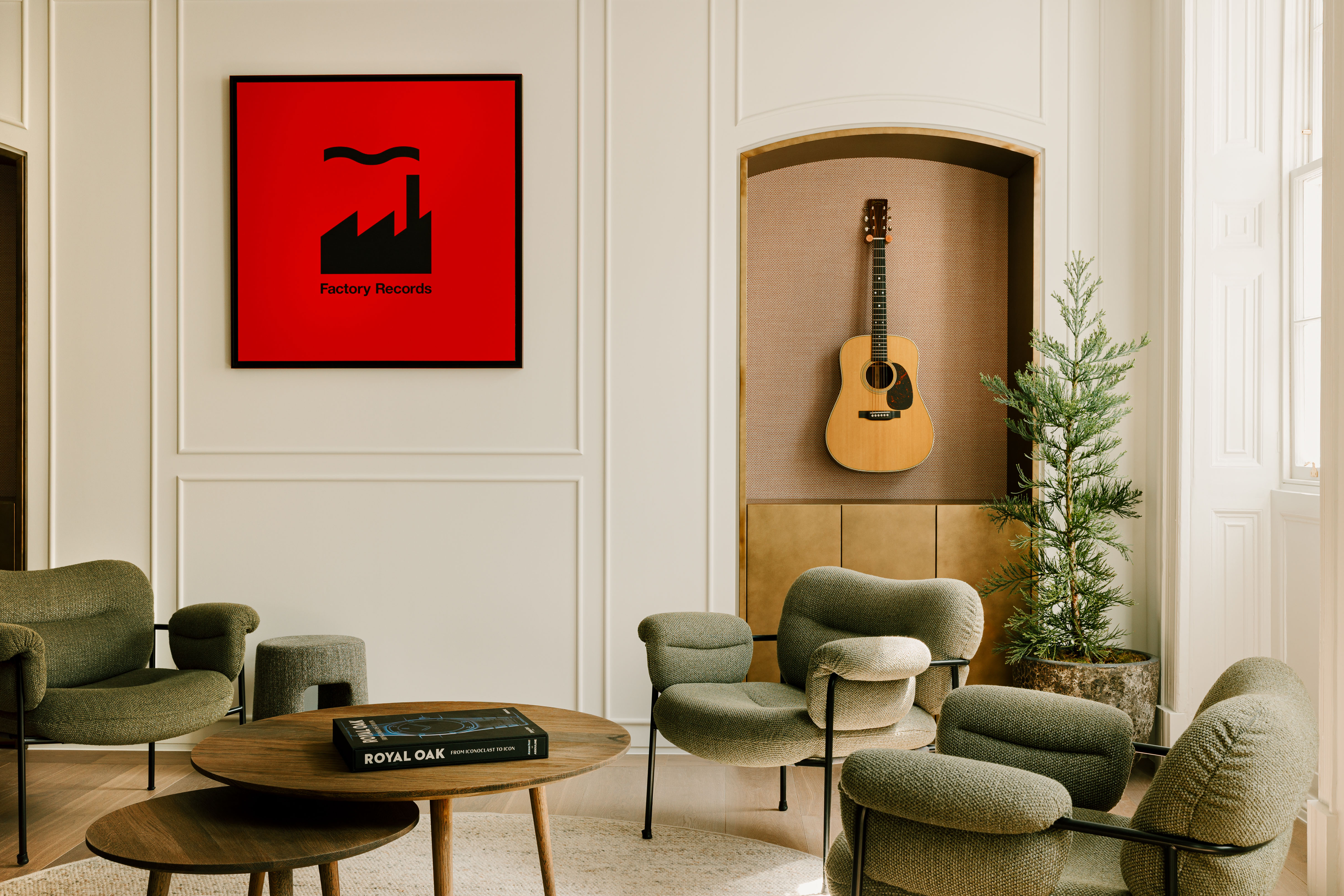 Music room at AP House Manchester, with Factory Records poster and guitar on wall