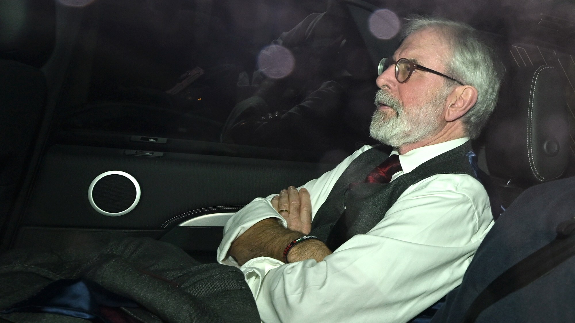Gerry Adams in the back of a car after leaving The Royal Courts of Justice 