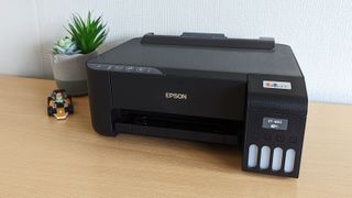 Front view of the Epson EcoTank ET-1810 printer sat on a table