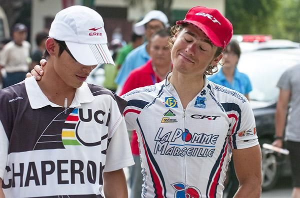 Tour leader Justin Jules (Velo Club-La Pomme Marseille) makes his way towards the press conference in Dongfang.