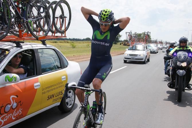 A Movistar rider loads bottles during stage 1 of the Tour de San Luis.