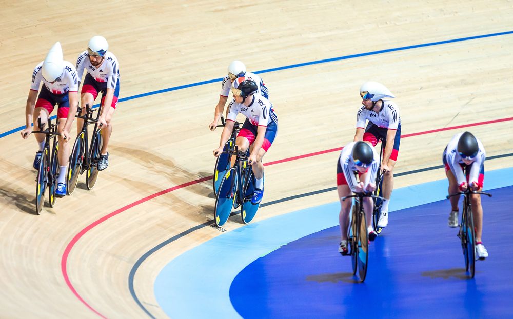 Members of the men's team emerge onto the track