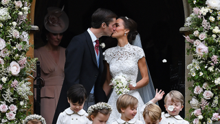 Pippa Middleton kisses her new husband James Matthews, following their wedding ceremony at St Mark's Church in Englefield, west of London, on May 20, 2017