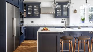 blue Shaker kitchen with large kitchen island and herringbone wooden floor