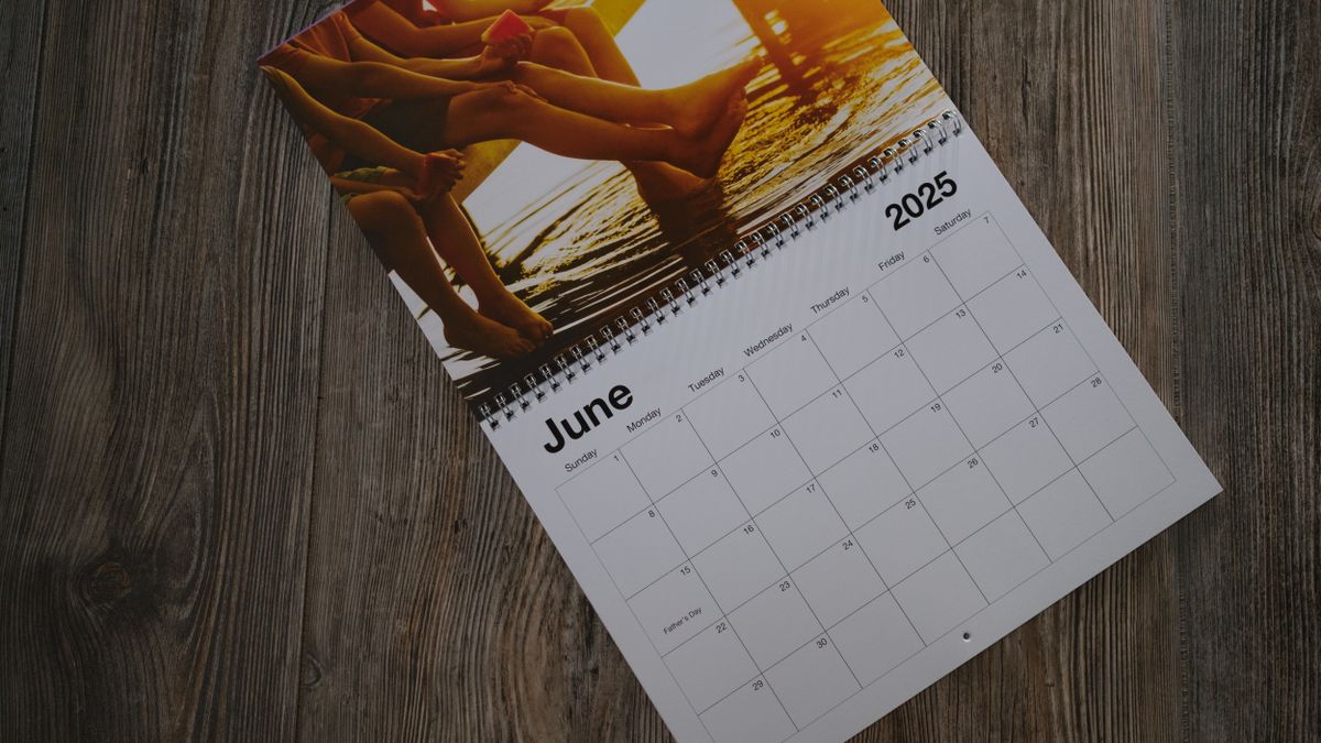 A photo calendar from Shutterfly on a wood background