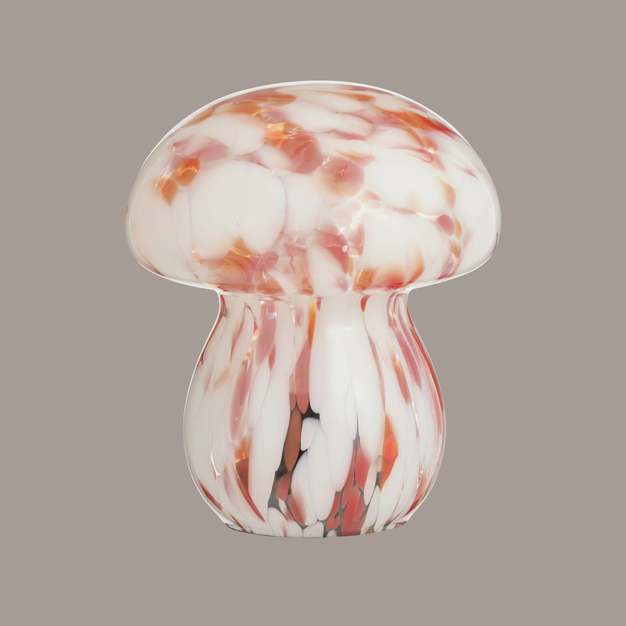 Mushroom Glass Battery Powered Table Lamp against pale brown background.