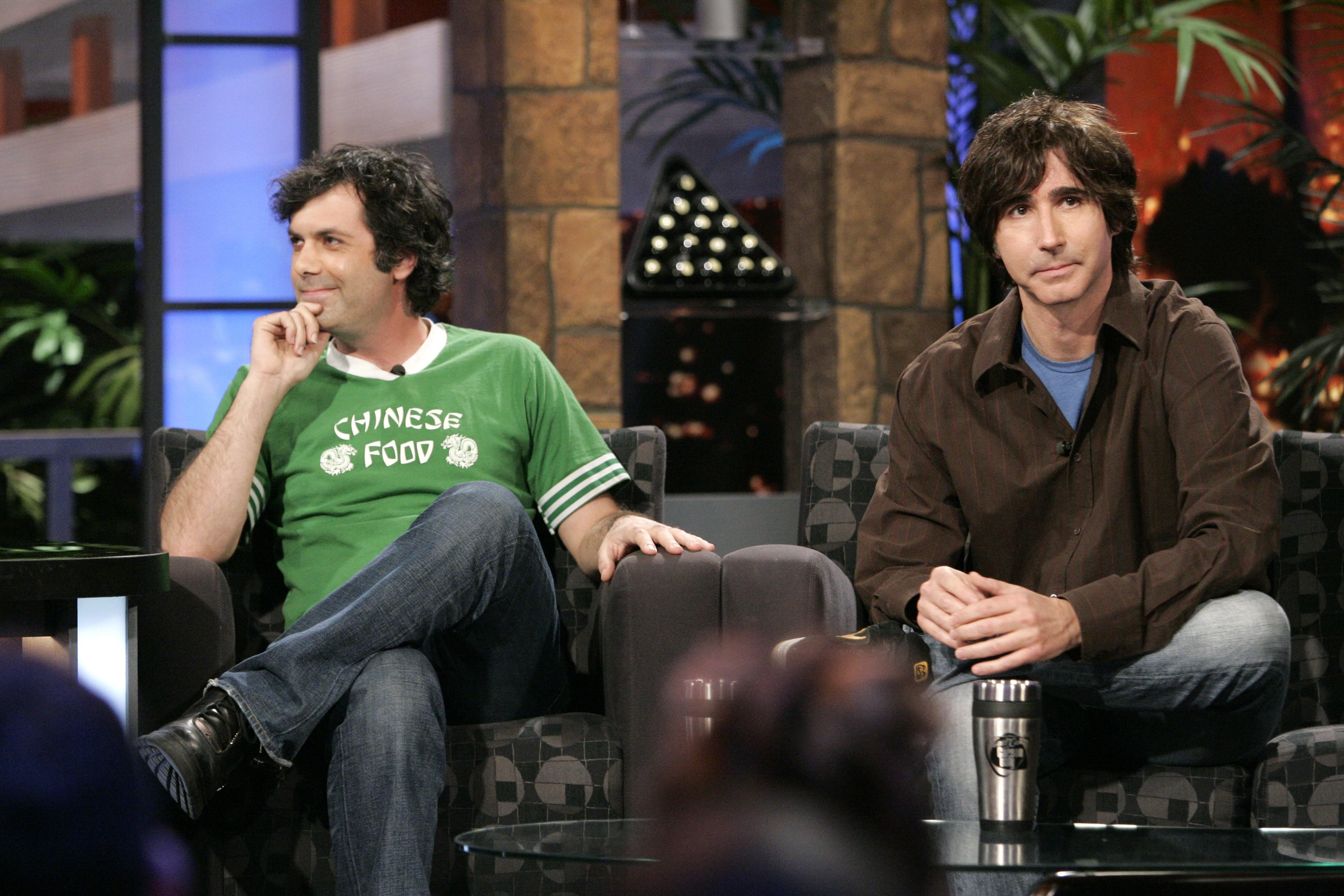 two men sit on a couch in the tv show Kenny vs Spenny