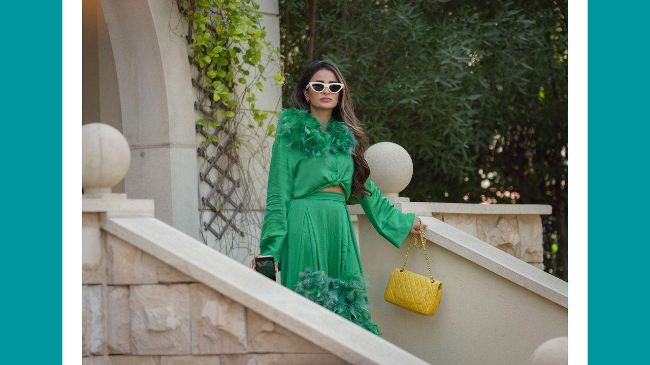 Netflix&#039;s Dubai Bling scene - Safa Siddiqui coming down the stairs in a green dress in Dubai Bling