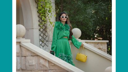 Netflix's Dubai Bling scene - Safa Siddiqui coming down the stairs in a green dress in Dubai Bling