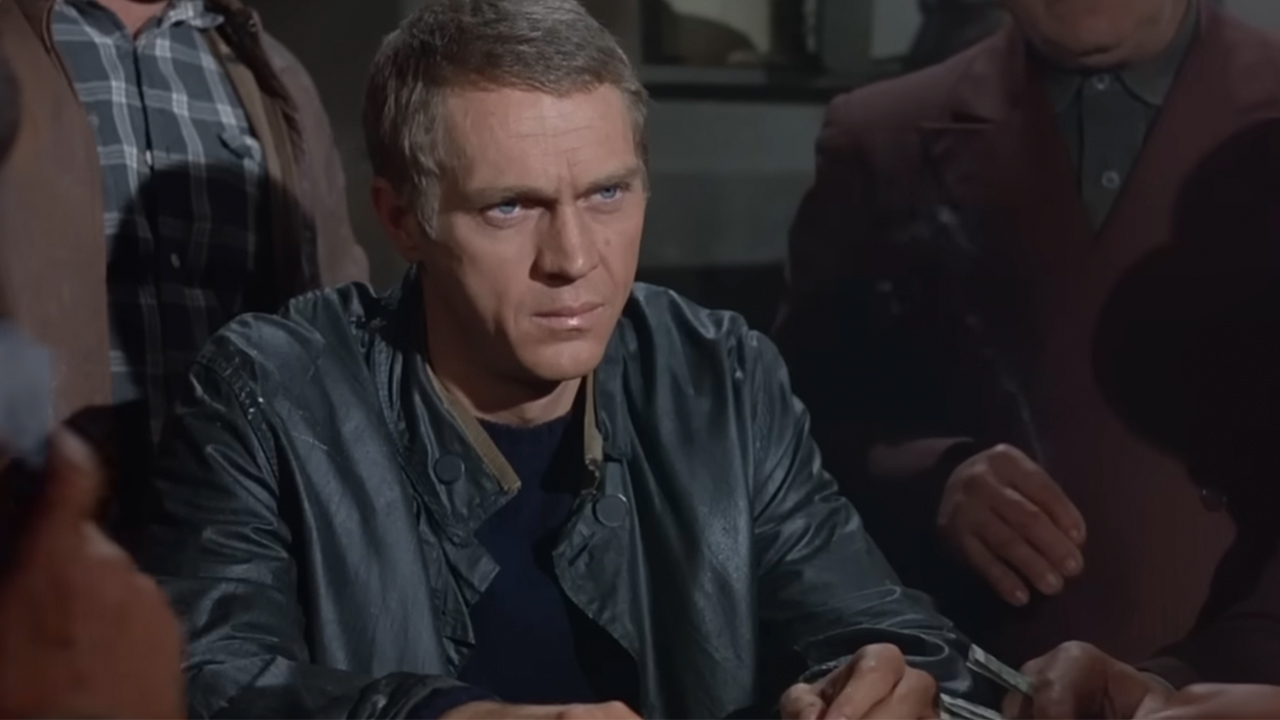 Steve McQueen in a leather jacket, looking very serious in The Cincinnati Kid