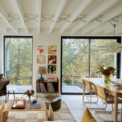 Sliding patio doors and a fixed glazed panel in open plan living diner space