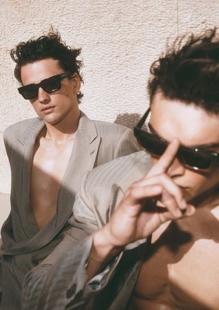 Two men in sun in Giorgio Armani suits