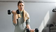 Woman lifting weights in upper-body workout