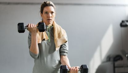 Woman lifting weights in upper-body workout