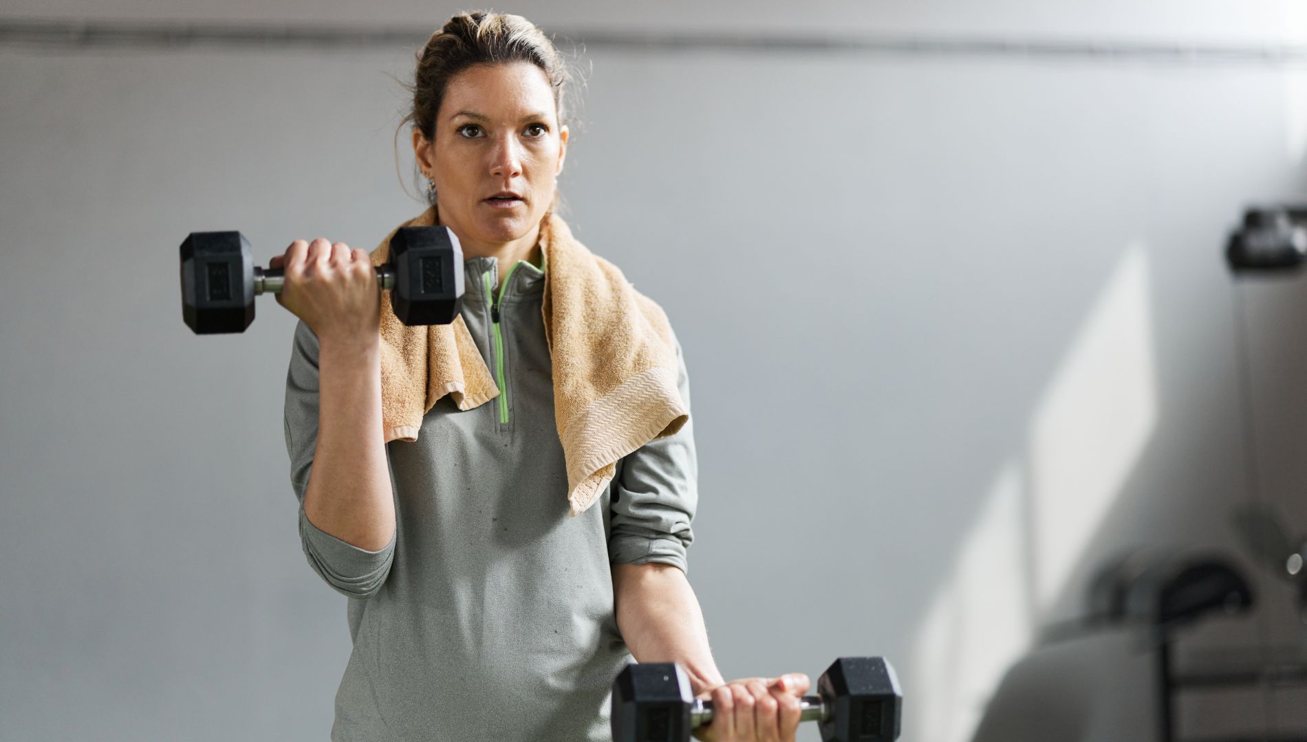 Woman lifting weights in upper-body workout