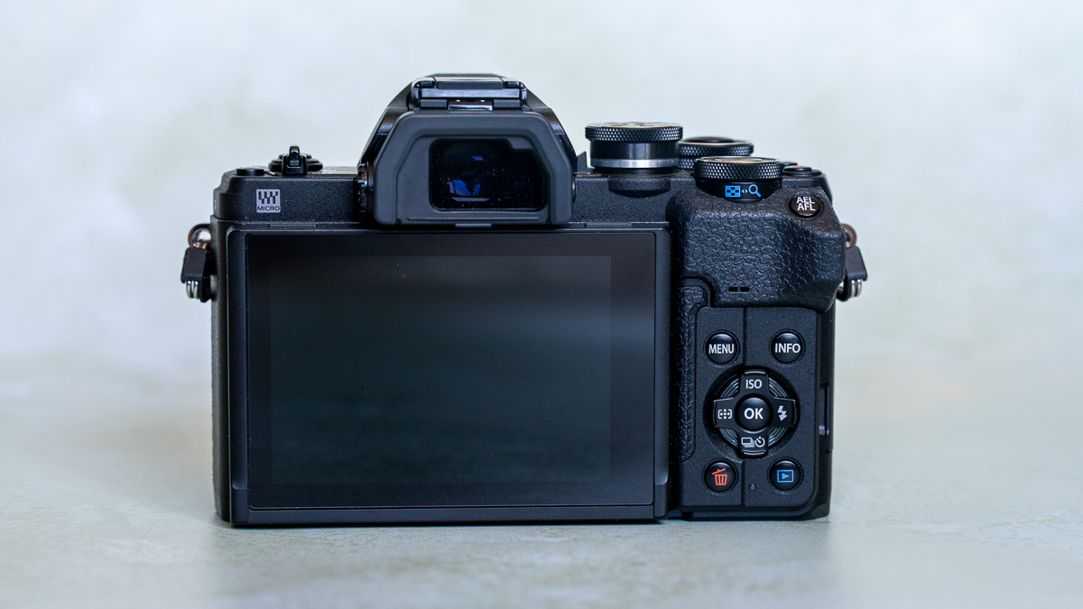 Rear view of the Olympus OM-D E-M10 Mark IV on a plain background