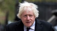 Boris Johnson walks through Downing Street