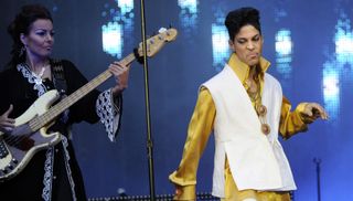 Prince and Ida Nielsen (L) perform on stage at the Stade de France in Saint-Denis, outside Paris, on June 30, 2011