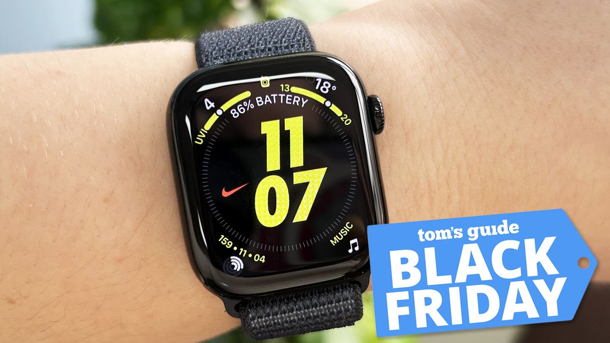 Wrist wearing Apple Watch 10 in black with Tom&#039;s Guide Black Friday badge on bottom right corner