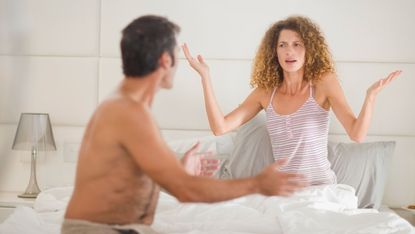 couple arguing in bed for story on how brexit rows lead to people sleeping separately