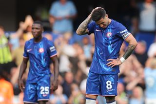 A dejected Enzo Fernandez of Chelsea after conceding the second goal during the Premier League match between Chelsea FC and Manchester City FC at Stamford Bridge on August 18, 2024 in London, England.