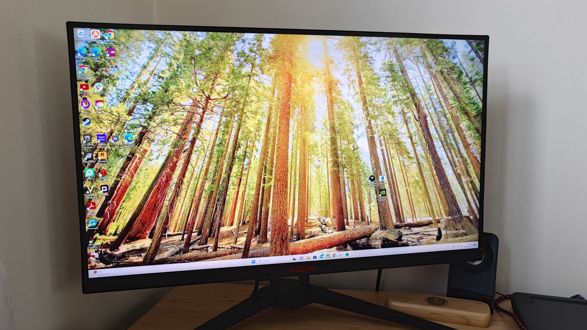 An AOC AGON AG275QXN monitor on a desk