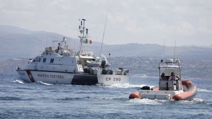 Italian Coast Guard boats are seen during search and rescue operations for the yacht Bayesian.