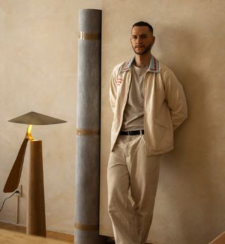 Federico Stefanovich, photographed by Maureen M Evans, in his Mexico City studio,with his ‘Folia’ floor lamp, and ‘Temis’ candleholder