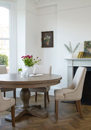 wooden dining table with fabric chairs by out and out