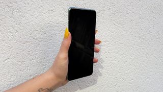 Realme GT 2 Pro review: black screen held up against a white wall