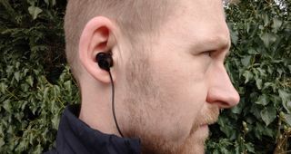 Man wearing wired headphones