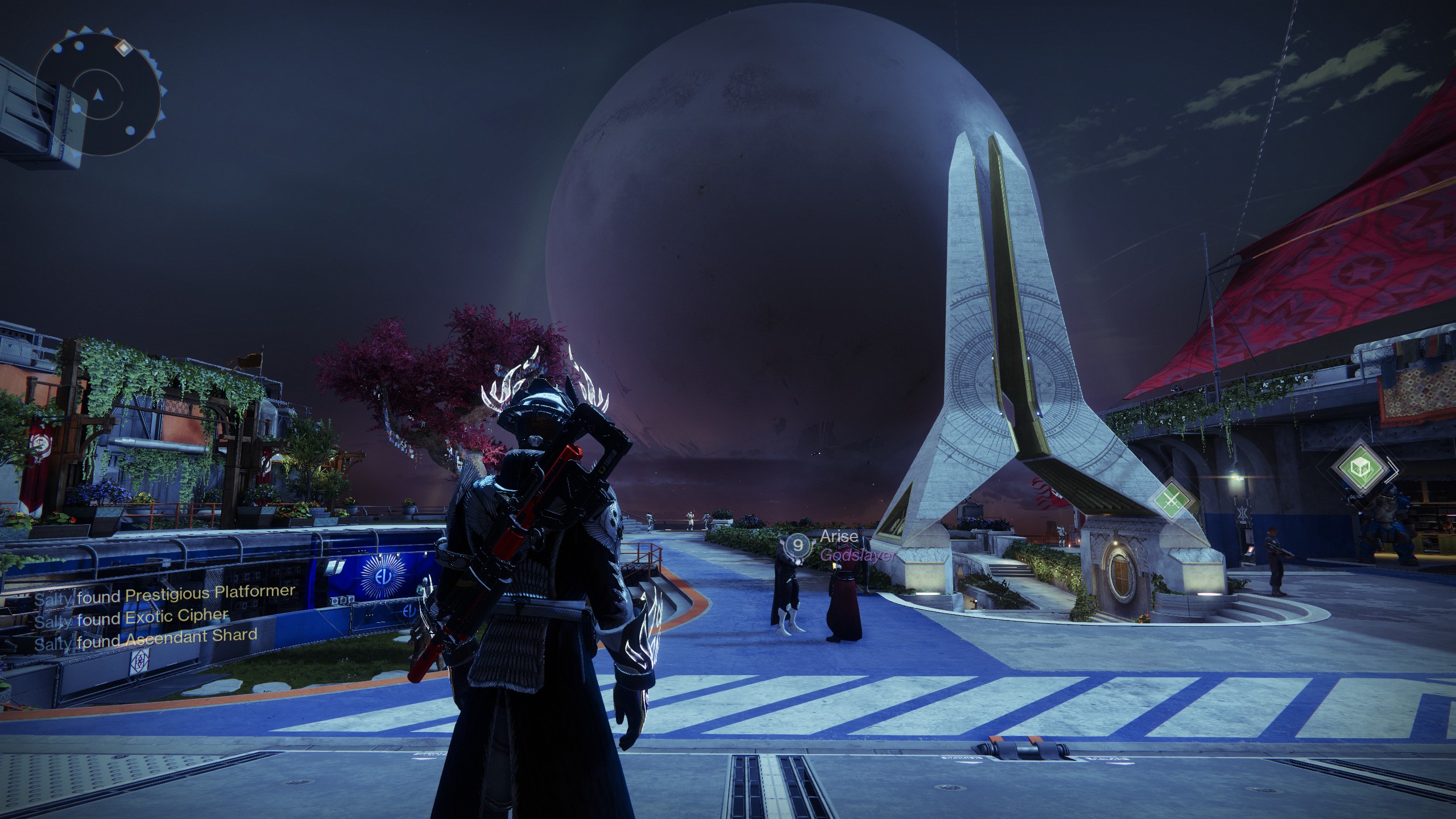 The Traveler sitting over the city.