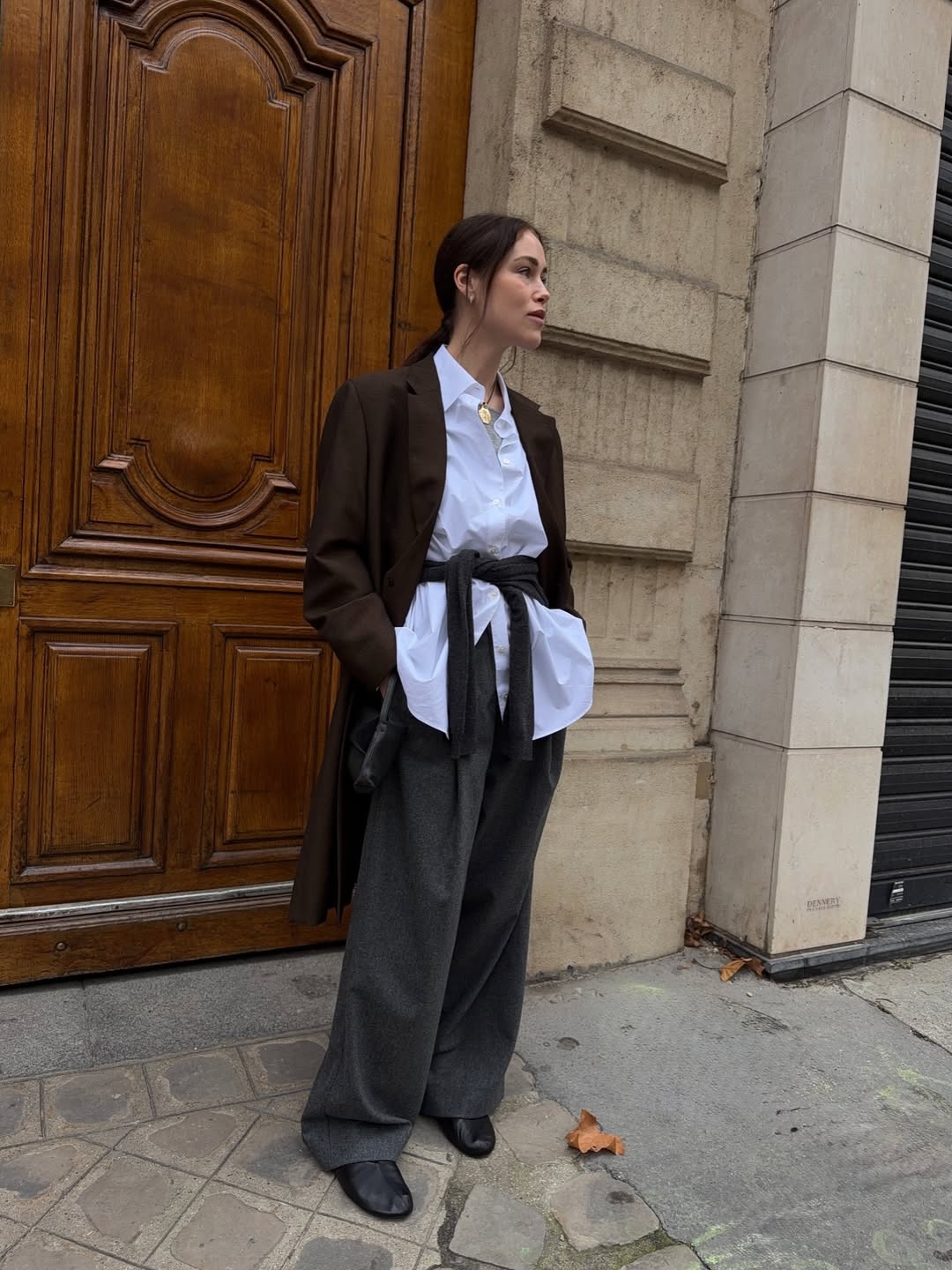 Influencer Annabel Rosendahl wearing wide-leg trousers and ballet flats.
