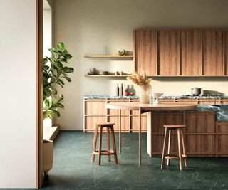 round section added to wooden kitchen island with slim legs supporting the addition