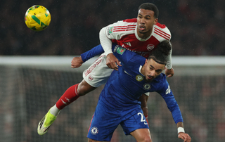 Chelsea's French defender #27 Malo Gusto (R) vies with Arsenal's Brazilian defender #06 Gabriel Magalhaes (C) during the English League Cup semi final second leg, football match between Arsenal and Chelsea at the Emirates Stadium, in London on February 3, 2026.