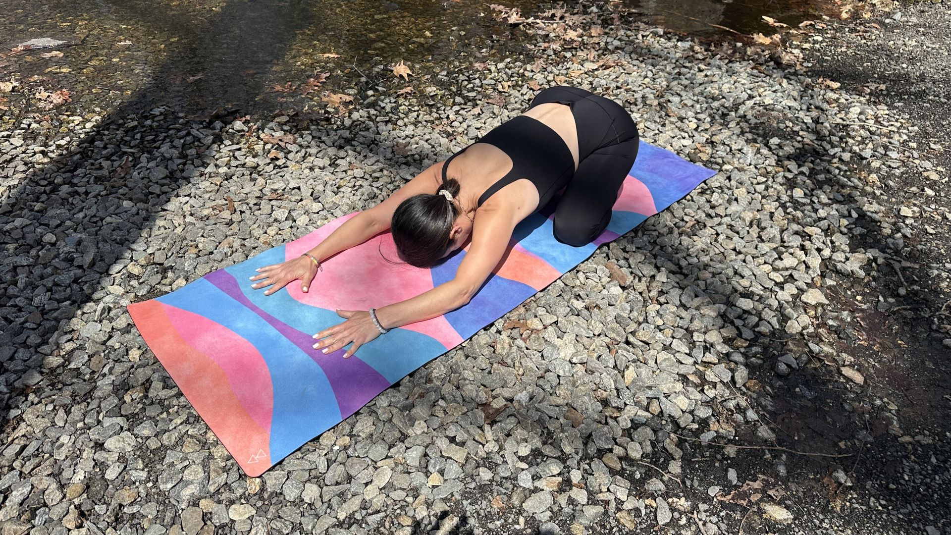 Yoga instructor Leah Pucciarelli demonstrates child's pose