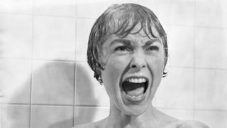 In the shower scene from the film Psycho, Marion Crane (played by Janet Leigh) screams in terror as Norman Bates tears open her shower curtain. (Photo by Bettmann via Getty Images)