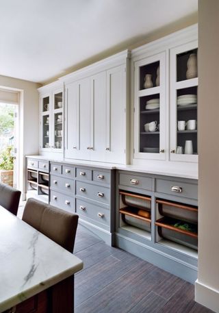 Built in crates used in a luxurious kitchen as a kitchen storage idea