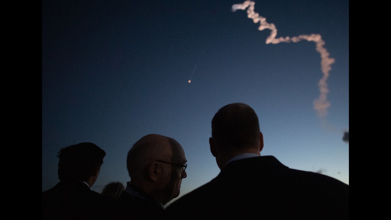 Florida Gov. Ron DeSantis (left), Tory Bruno, president and CEO of the United Launch Alliance, and NASA Administrator Jim Bridenstine watch from NASA&rsquo;s Kennedy Space Center in Florida as a United Launch Alliance Atlas V rocket with Boeing&rsquo;s CST-100 Starliner spacecraft on board launches from Space Launch Complex 41 at Cape Canaveral Air Force Station, on Dec. 20, 2019.