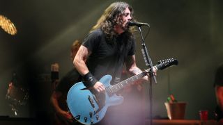 Dave Grohl performing on stage with Foo Fighters, 2021