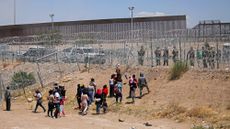 Migrants attempt to cross the U.S.-Mexico border in Ciudad Juarez, Mexico